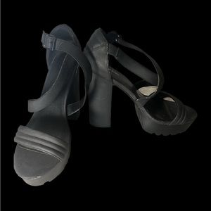 Tall, chunky, black strappy high heels